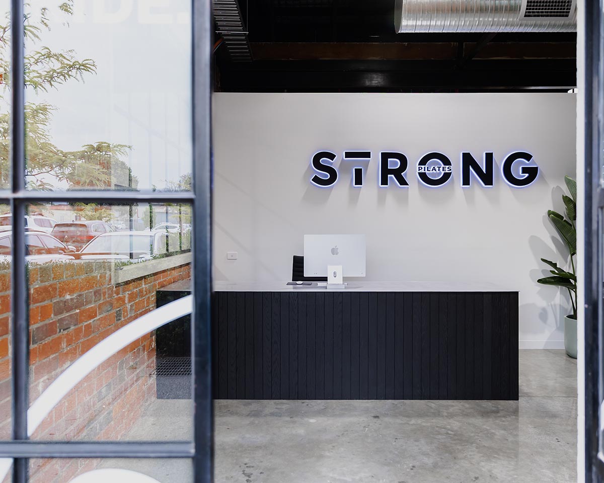STRONG Pilates studio entrance and front desk